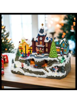 Villaggio Innevato con chiesa, trenino, albero di Natale e giostra bambini rotante, h 27 cm