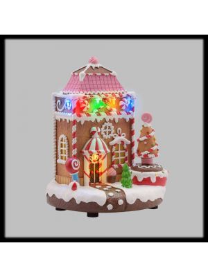 Villaggio natalizio, casa di marzapane con albero rotante e musica
